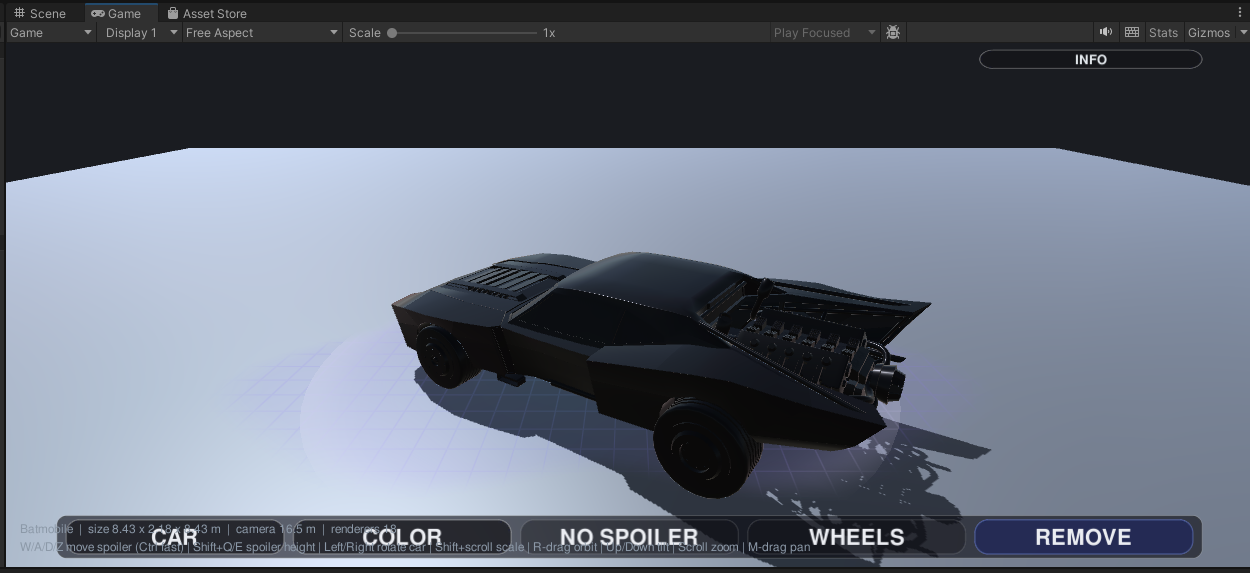 Batmobile placed in the test harness, callipers-only paint group, built-in rear fins, contact shadow underneath.
